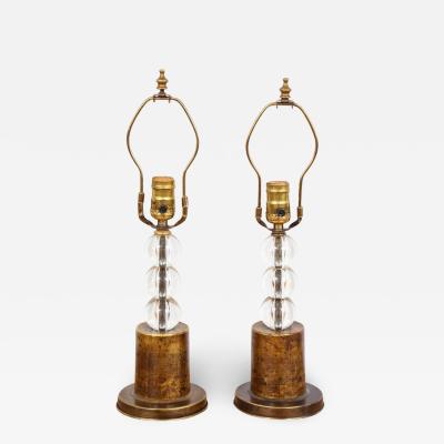 Pair of orb lamps on brass plinth base