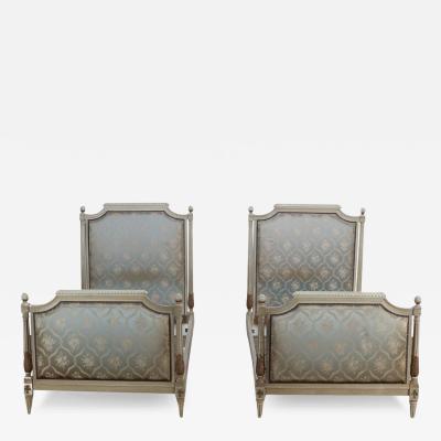 Pair of painted and carved French Louis XVI style upholstered twin beds C 1930 