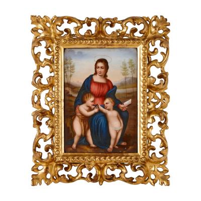 Pair of porcelain plaques in giltwood frames after Old Master Madonnas