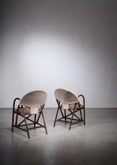 Pair of rattan and canvas chairs