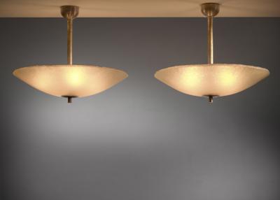 Pair of raw yellow glass pendants