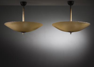 Pair of raw yellow glass pendants