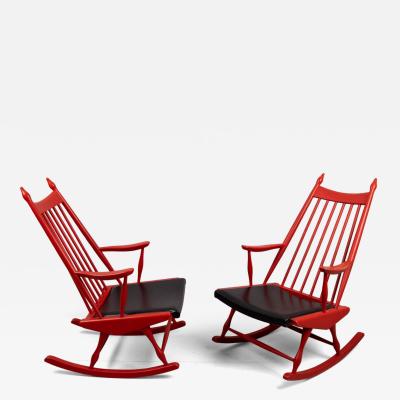 Pair of red rocking chairs