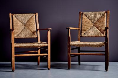 Pair of rustic Oak Lounge Chairs with hand woven Rush Seats