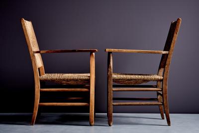 Pair of rustic Oak Lounge Chairs with hand woven Rush Seats