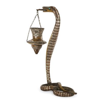 Pair of silver inlaid brass Art Deco serpent candle holders