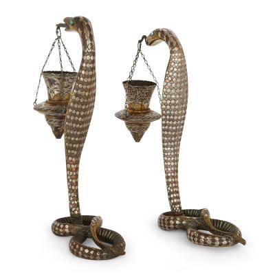 Pair of silver inlaid brass Art Deco serpent candle holders