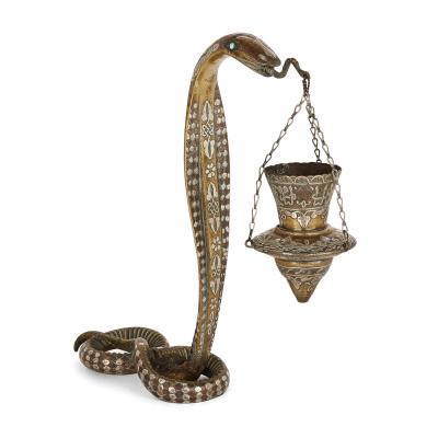 Pair of silver inlaid brass Art Deco serpent candle holders