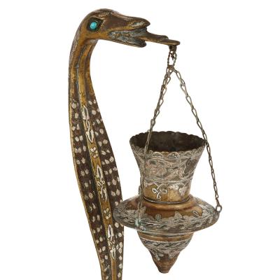 Pair of silver inlaid brass Art Deco serpent candle holders