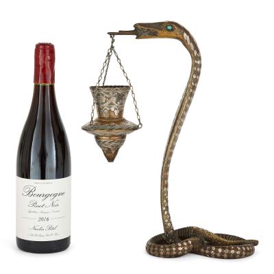 Pair of silver inlaid brass Art Deco serpent candle holders