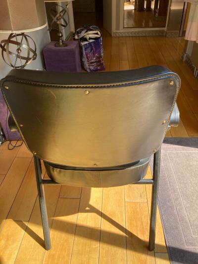 Pair of stitched Leather armchairs by Jacques Adnet