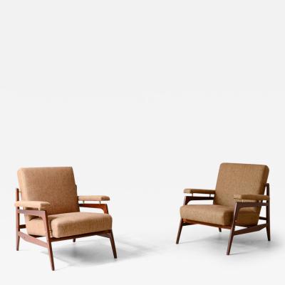 Pair of stylish modernist armchairs in wood and upholstery