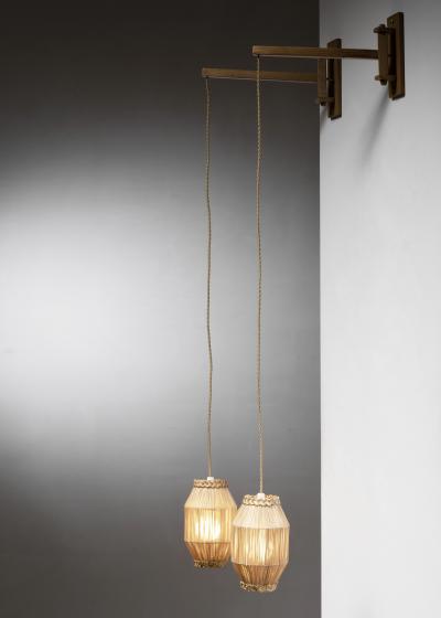 Pair of swiveling wall lamps