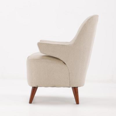 Pair of upholstered lounge chairs circa 1950 having floating arms and new fabric