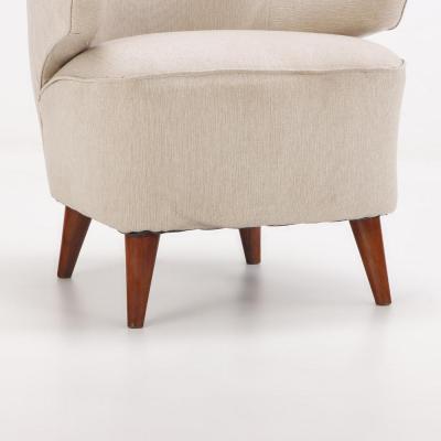 Pair of upholstered lounge chairs circa 1950 having floating arms and new fabric