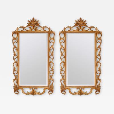 Pair of very large French giltwood mirrors with scrolled acanthus borders