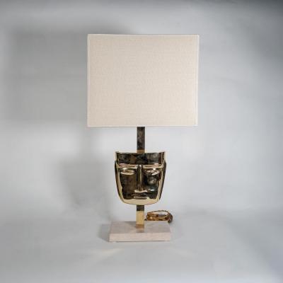 Pair of vintage brass sculpture face mask table lamps