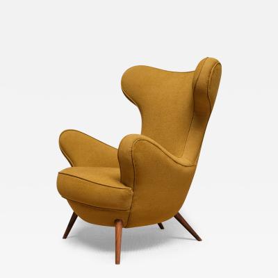 Paolo Malchiodi Paolo Malchiodi Wingback Chair in Yellow Ochre Fabric and Walnut Italy 1940s