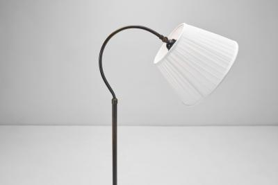 Patinated Brass Floor Lamp with Curved Neck Europe 20th century