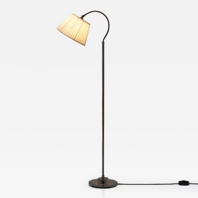 Patinated Brass Floor Lamp with Curved Neck Europe 20th century