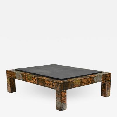 https://cdn.incollect.com/sites/default/files/medium/Paul-Evans-Brutalist-Mixed-Metal-and-Slate-Coffee-Table-375220-1444861.jpg