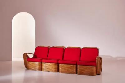 Paul Frankl A four seat rattan and fabric sectional sofa in the style of Paul Theodore Frank