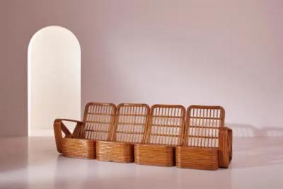 Paul Frankl A four seat rattan and fabric sectional sofa in the style of Paul Theodore Frank