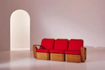Paul Frankl A four seat rattan and fabric sectional sofa in the style of Paul Theodore Frank