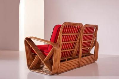Paul Frankl A four seat rattan and fabric sectional sofa in the style of Paul Theodore Frank