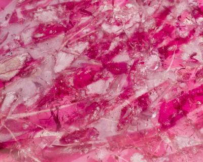 Pedestal table in resin with inclusions and gold plated brass
