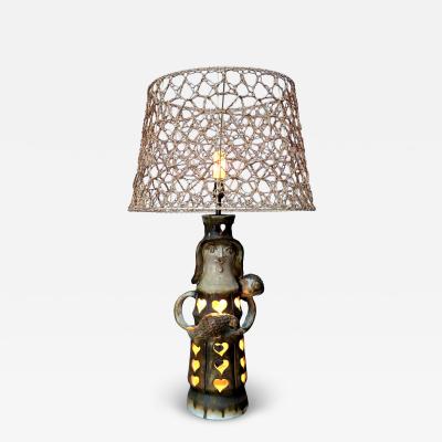 Pottery lamp with heart motif with original string shade