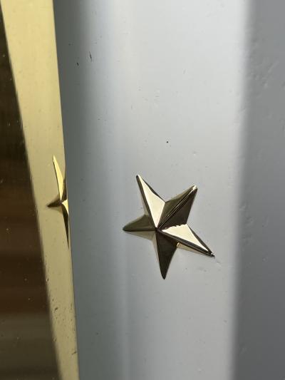 RARE MONUMENTAL POLISHED BRASS AND GLASS ART DECO SCONCES WITH STAR ACCENTS