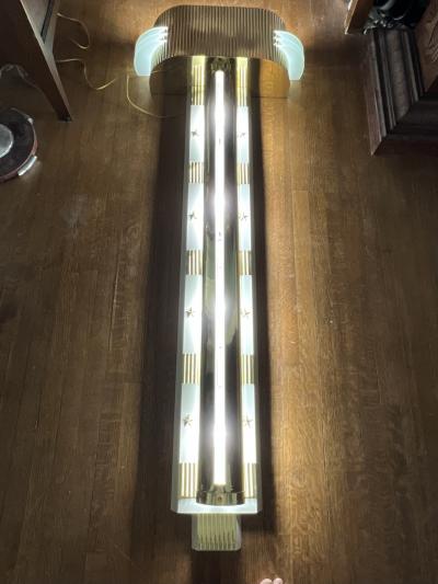 RARE MONUMENTAL POLISHED BRASS AND GLASS ART DECO SCONCES WITH STAR ACCENTS