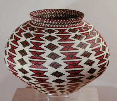 Rain Forest Basket Panama by Ana Cabezon finely woven red green black geometric