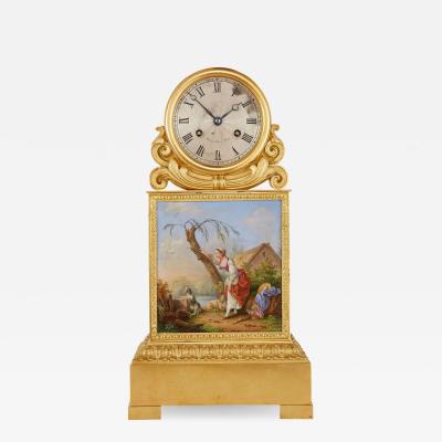 Raingo Fr res Ormolu and porcelain antique mantel clock by Raingo Fr res