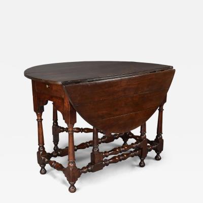 Rare early 18th century walnut gateleg table of fine patina
