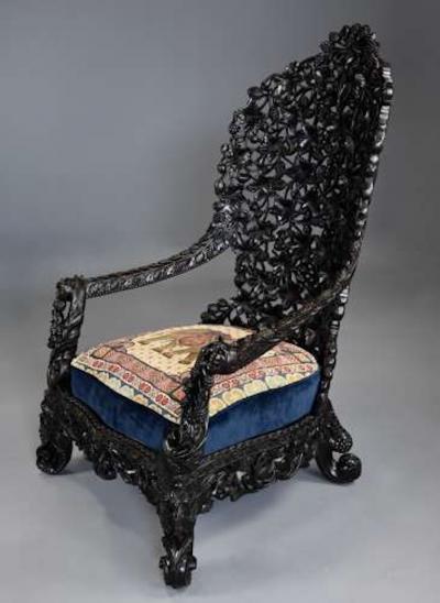 Rare highly decorative profusely carved 19thc Indian armchair