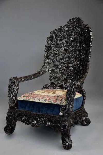 Rare highly decorative profusely carved 19thc Indian armchair