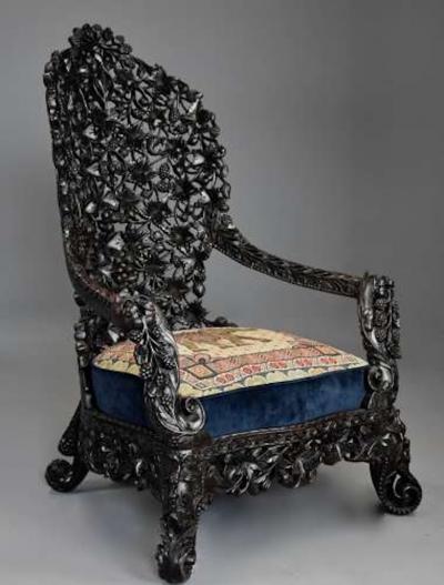 Rare highly decorative profusely carved 19thc Indian armchair