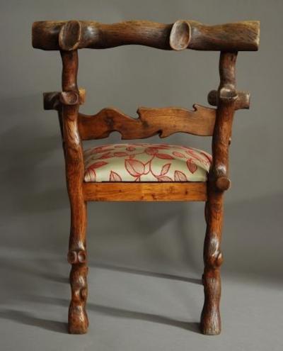 Rare mid 19th century carved elm armchair of naturalistic form