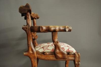 Rare mid 19th century carved elm armchair of naturalistic form
