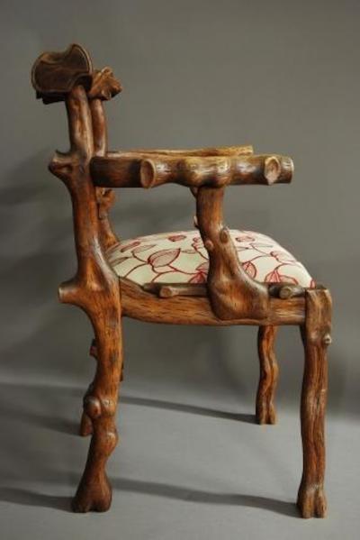 Rare mid 19th century carved elm armchair of naturalistic form