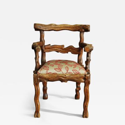 Rare mid 19th century carved elm armchair of naturalistic form