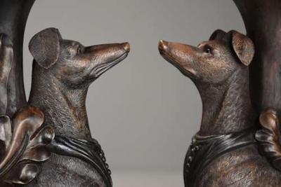 Rare pair of finely carved Black Forest hound side tables