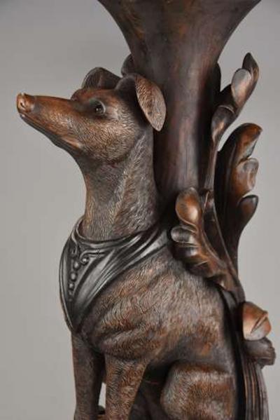 Rare pair of finely carved Black Forest hound side tables