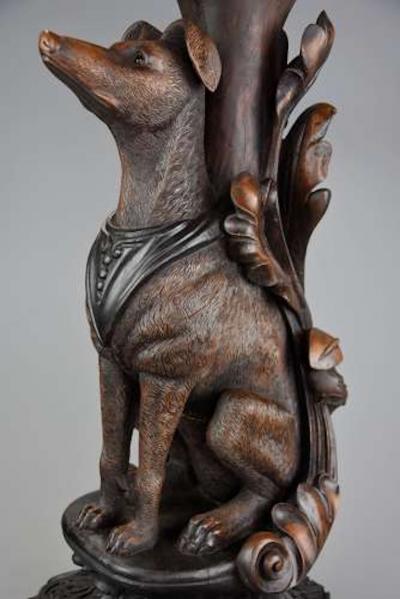 Rare pair of finely carved Black Forest hound side tables
