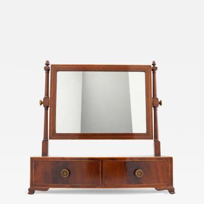 Rectangular mahogany swinger dressing mirror on a bow front stand with drawer