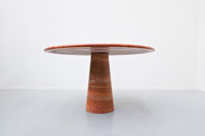 Red travertine dining table in style of Angelo Mangiarotti