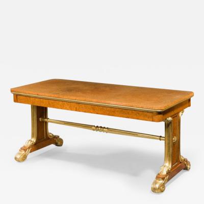 Regency Amboyna and parcel gilt end support library table