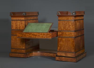 Regency flash mahogany and ebonized desk of double pylon architectural form